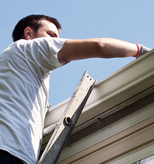 plumber inspecting gutter